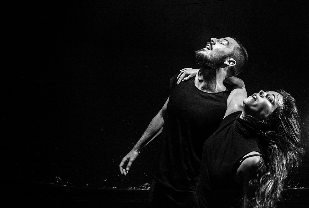 Couple dancing dramatically in black and white.