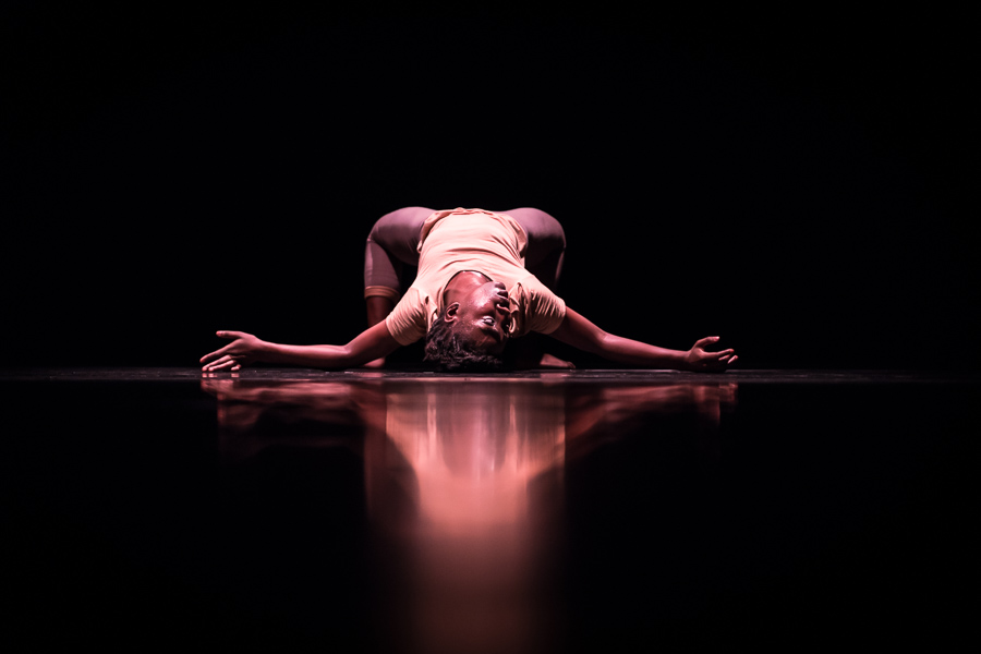 Dancer performing expressive solo on stage