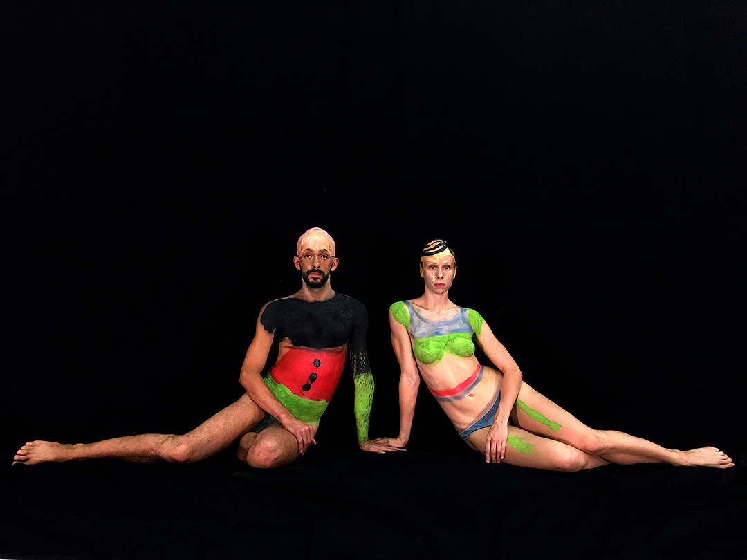 Two people with colourful body paint art.