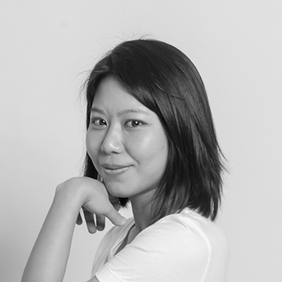 Black-and-white portrait of woman resting chin on hand