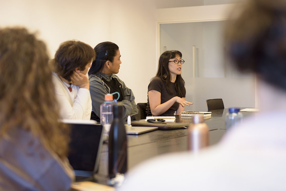 Woman speaking during meeting in conference room